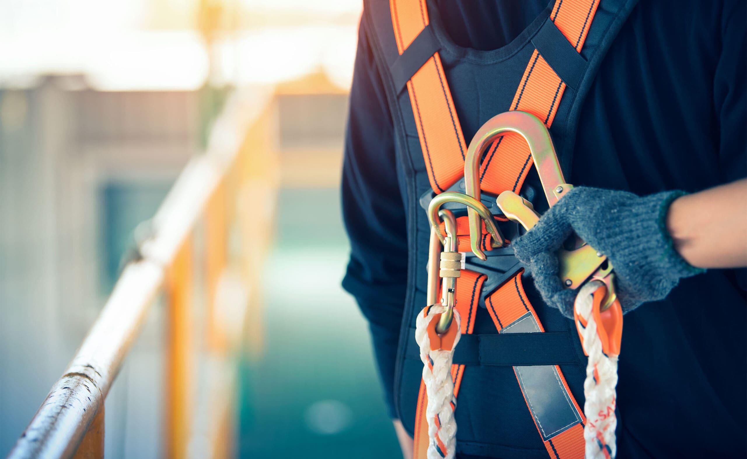 Construction worker wearing safety harness and safety line worki Safety Harness