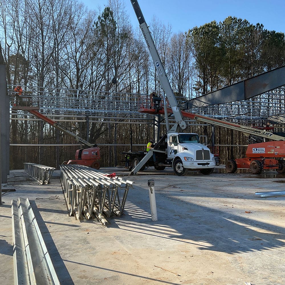 Cranes moving steel elements into place at Swift Atlanta construction