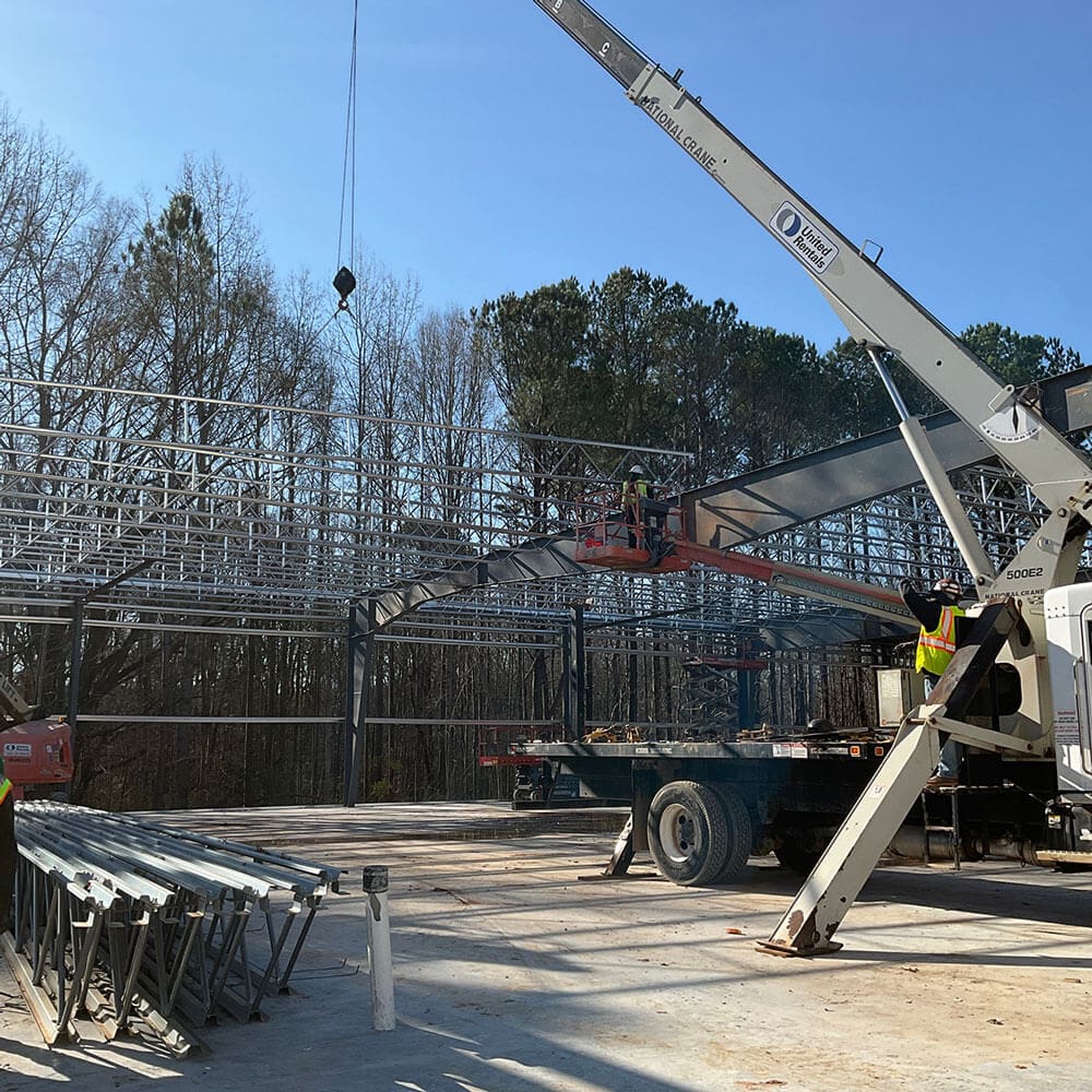 Cranes moving metal into place on Swift Atlanta construction